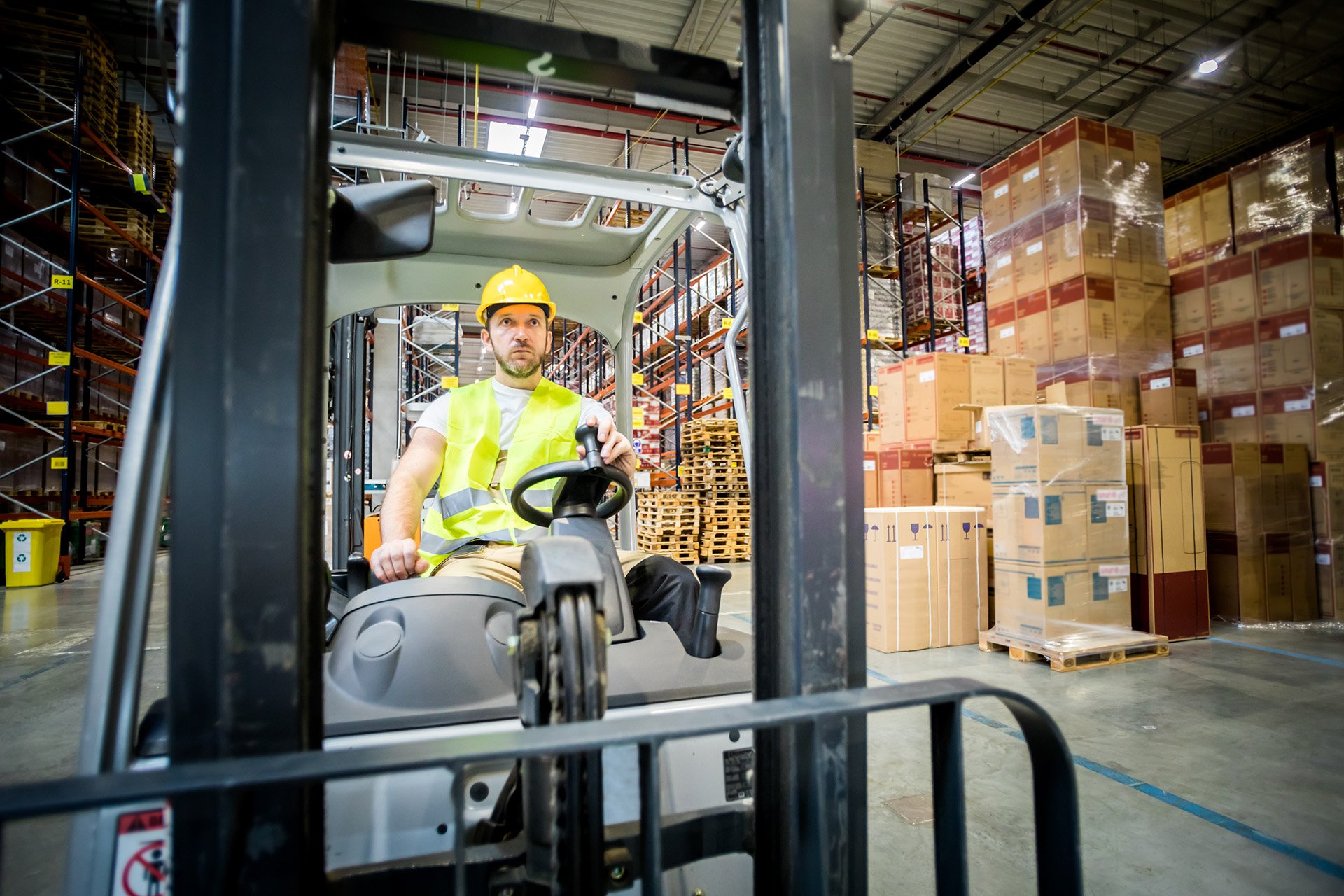 forklift-operator-during-work-in-large-warehouse-2021-08-29-22-34-36-utc